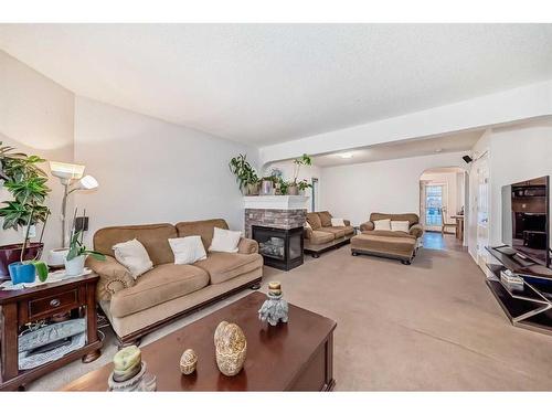 4 Saddlebrook Circle Ne, Calgary, AB - Indoor Photo Showing Living Room With Fireplace