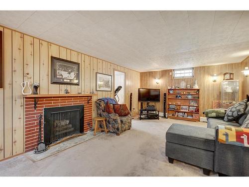 1352 Lake Sylvan Drive Se, Calgary, AB - Indoor Photo Showing Living Room With Fireplace