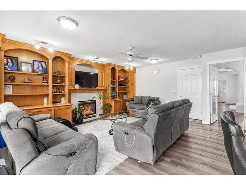 291 Taracove Estate Drive Ne, Calgary, AB - Indoor Photo Showing Living Room With Fireplace