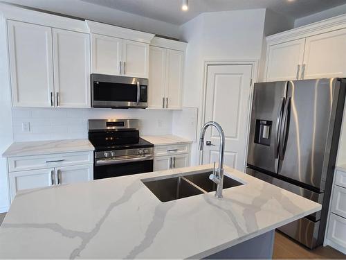 20 Cranridge Crescent Se, Calgary, AB - Indoor Photo Showing Kitchen With Stainless Steel Kitchen With Double Sink With Upgraded Kitchen