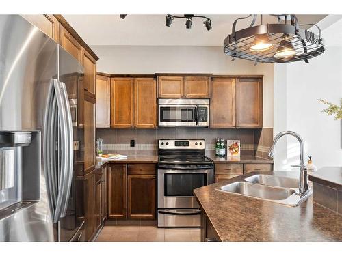 42 Mahogany Terrace Se, Calgary, AB - Indoor Photo Showing Kitchen With Double Sink With Upgraded Kitchen