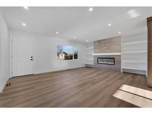 417 Huntley Way Ne, Calgary, AB - Indoor Photo Showing Living Room With Fireplace