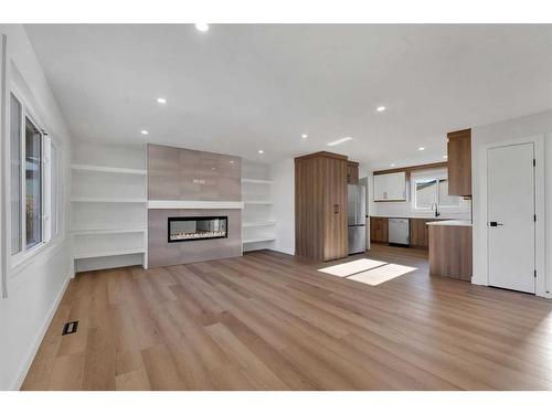 417 Huntley Way Ne, Calgary, AB - Indoor Photo Showing Living Room With Fireplace