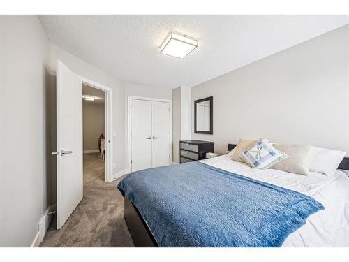 213 Springbluff Boulevard Sw, Calgary, AB - Indoor Photo Showing Bedroom