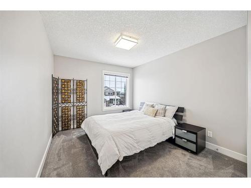 213 Springbluff Boulevard Sw, Calgary, AB - Indoor Photo Showing Bedroom