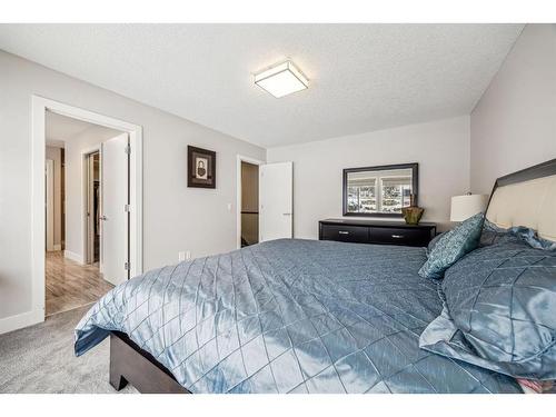 213 Springbluff Boulevard Sw, Calgary, AB - Indoor Photo Showing Bedroom