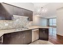 1607-8710 Horton Road Sw, Calgary, AB  - Indoor Photo Showing Kitchen With Double Sink 