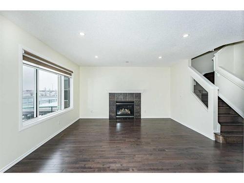 110 Saddlecrest Close Ne, Calgary, AB - Indoor Photo Showing Living Room With Fireplace