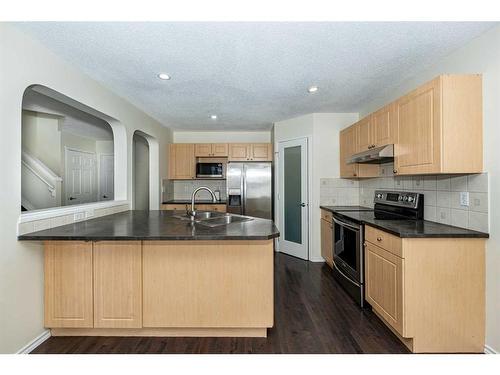 110 Saddlecrest Close Ne, Calgary, AB - Indoor Photo Showing Kitchen With Double Sink