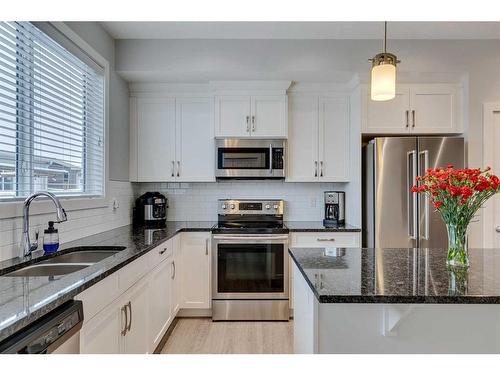 1261 Legacy Circle Se, Calgary, AB - Indoor Photo Showing Kitchen With Stainless Steel Kitchen With Double Sink With Upgraded Kitchen