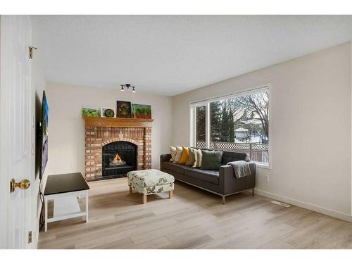 208 Mt Selkirk Close Se, Calgary, AB - Indoor Photo Showing Living Room With Fireplace