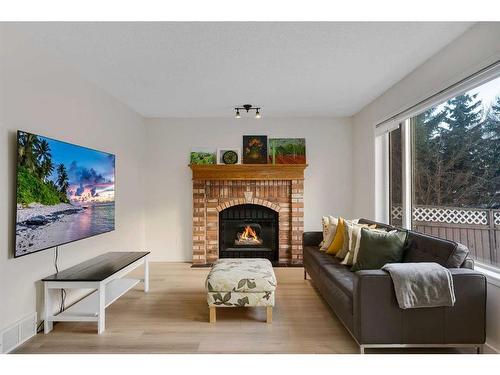 208 Mt Selkirk Close Se, Calgary, AB - Indoor Photo Showing Living Room With Fireplace