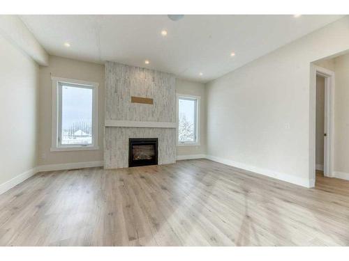 41 Farries Drive Se, Airdrie, AB - Indoor Photo Showing Living Room With Fireplace