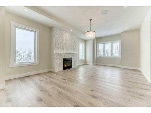 41 Farries Drive Se, Airdrie, AB - Indoor Photo Showing Living Room With Fireplace