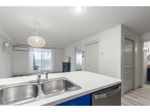 109-304 Cranberry Park Se, Calgary, AB - Indoor Photo Showing Kitchen With Double Sink