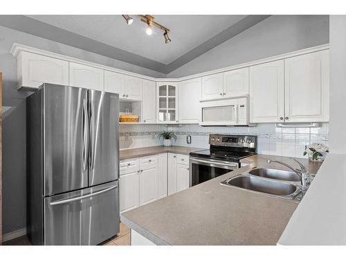 106 Creek Gardens Place Nw, Airdrie, AB - Indoor Photo Showing Kitchen With Double Sink