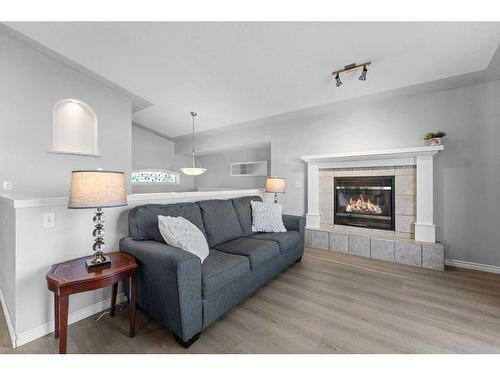 106 Creek Gardens Place Nw, Airdrie, AB - Indoor Photo Showing Living Room With Fireplace