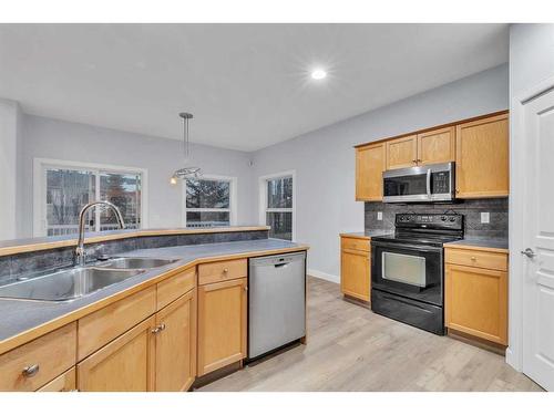 125 Discovery Place Sw, Calgary, AB - Indoor Photo Showing Kitchen With Double Sink