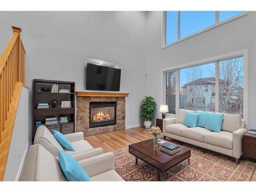 125 Discovery Place Sw, Calgary, AB - Indoor Photo Showing Living Room With Fireplace