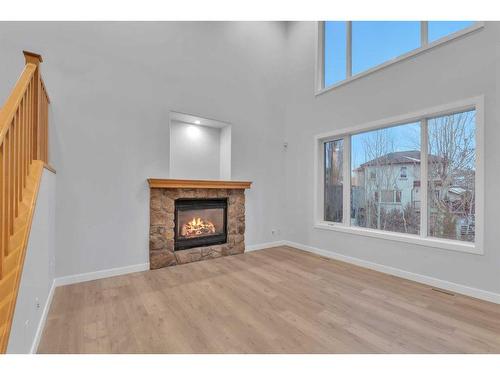 125 Discovery Place Sw, Calgary, AB - Indoor Photo Showing Living Room With Fireplace