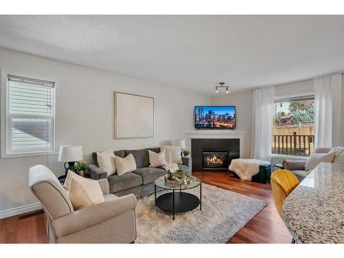 24 Tuscarora Place Nw, Calgary, AB - Indoor Photo Showing Living Room With Fireplace