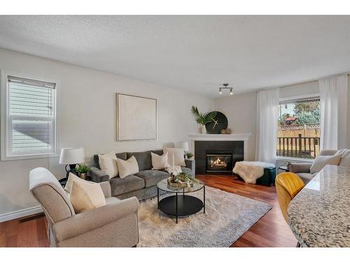 24 Tuscarora Place Nw, Calgary, AB - Indoor Photo Showing Living Room With Fireplace