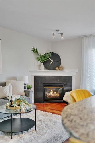 24 Tuscarora Place Nw, Calgary, AB - Indoor Photo Showing Living Room With Fireplace