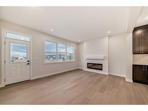 320 Homestead Grove Ne, Calgary, AB - Indoor Photo Showing Living Room With Fireplace