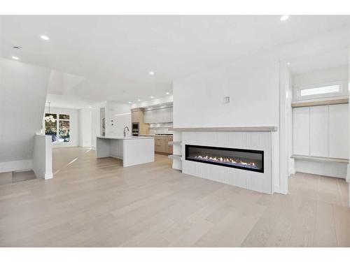 721 36 Street Nw, Calgary, AB - Indoor Photo Showing Living Room With Fireplace