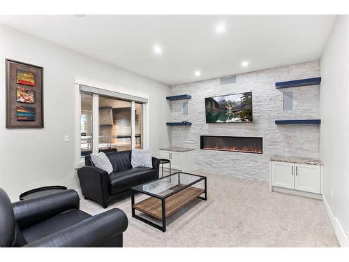 243 East Chestermere Drive, Chestermere, AB - Indoor Photo Showing Living Room With Fireplace