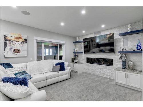 243 East Chestermere Drive, Chestermere, AB - Indoor Photo Showing Living Room With Fireplace