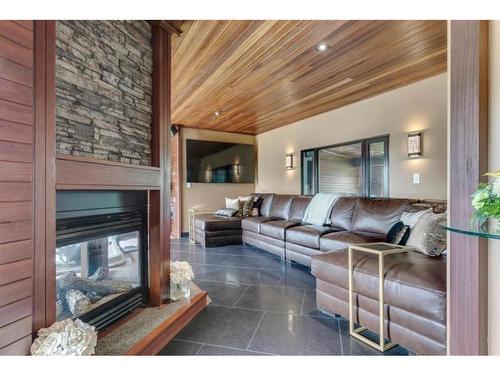 243 East Chestermere Drive, Chestermere, AB - Indoor Photo Showing Living Room With Fireplace