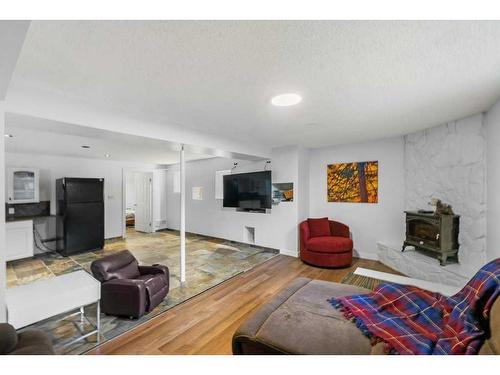 51 Lake Wapta Rise Se, Calgary, AB - Indoor Photo Showing Living Room With Fireplace