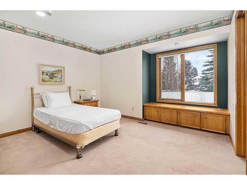 99 Oakmount Court Sw, Calgary, AB - Indoor Photo Showing Bedroom