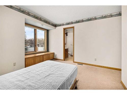 99 Oakmount Court Sw, Calgary, AB - Indoor Photo Showing Bedroom