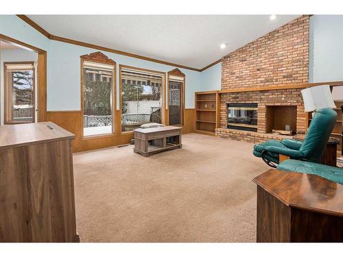 99 Oakmount Court Sw, Calgary, AB - Indoor Photo Showing Living Room With Fireplace