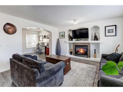 42 Royal Birch Terrace Nw, Calgary, AB - Indoor Photo Showing Living Room With Fireplace