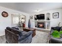 42 Royal Birch Terrace Nw, Calgary, AB  - Indoor Photo Showing Living Room With Fireplace 