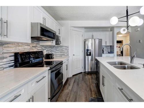 42 Royal Birch Terrace Nw, Calgary, AB - Indoor Photo Showing Kitchen With Stainless Steel Kitchen With Double Sink With Upgraded Kitchen