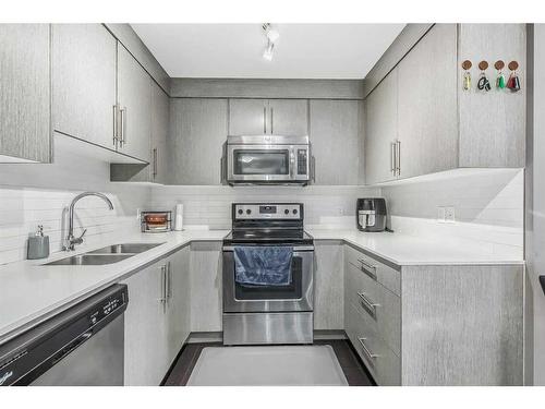 5305-302 Skyview Ranch Drive Ne, Calgary, AB - Indoor Photo Showing Kitchen With Stainless Steel Kitchen With Double Sink With Upgraded Kitchen