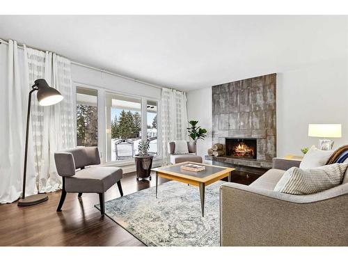 455 Cedarpark Drive Sw, Calgary, AB - Indoor Photo Showing Living Room With Fireplace