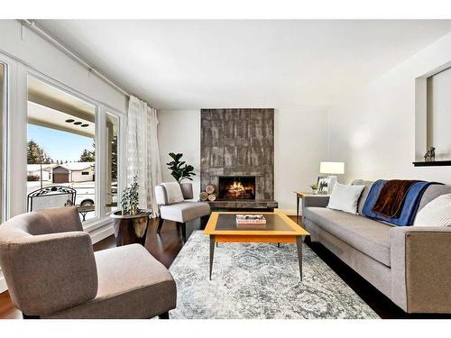 455 Cedarpark Drive Sw, Calgary, AB - Indoor Photo Showing Living Room With Fireplace