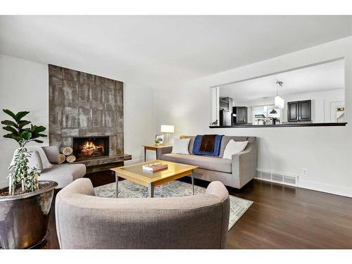 455 Cedarpark Drive Sw, Calgary, AB - Indoor Photo Showing Living Room With Fireplace