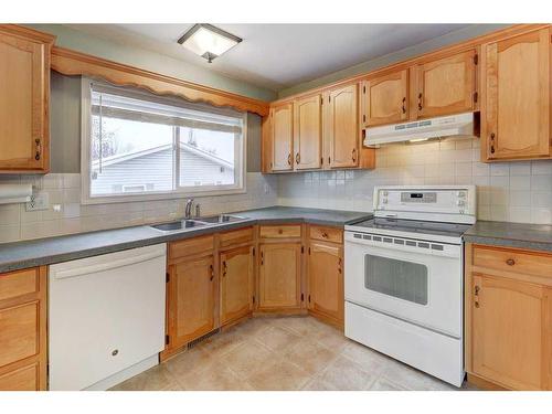 14547 Parkland Boulevard Se, Calgary, AB - Indoor Photo Showing Kitchen With Double Sink