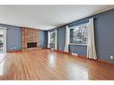 9927 5 Street Se, Calgary, AB  - Indoor Photo Showing Living Room With Fireplace 