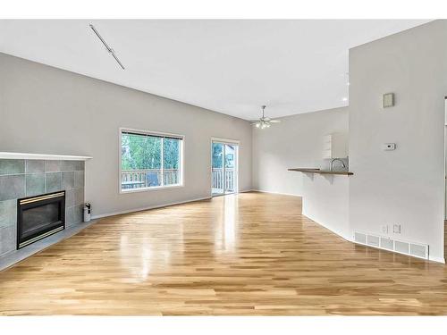 265 Somerside Park Sw, Calgary, AB - Indoor Photo Showing Living Room With Fireplace