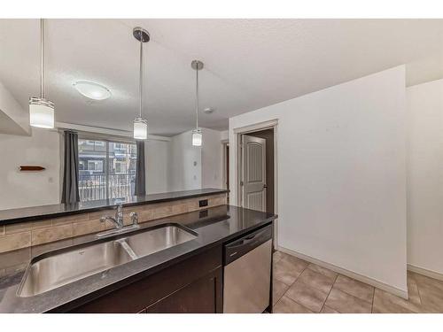 3109-115 Prestwick Villas Se, Calgary, AB - Indoor Photo Showing Kitchen With Double Sink