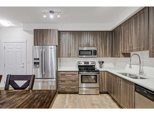 4417-99 Copperstone Park Se, Calgary, AB - Indoor Photo Showing Kitchen With Stainless Steel Kitchen With Double Sink With Upgraded Kitchen