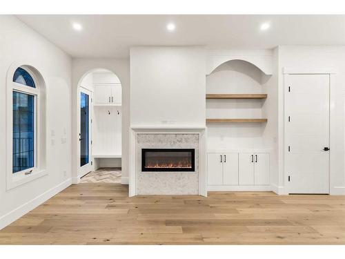 1919 21 Avenue Nw, Calgary, AB - Indoor Photo Showing Other Room With Fireplace