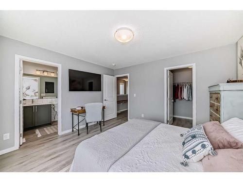 148 Dawson Drive, Chestermere, AB - Indoor Photo Showing Bedroom